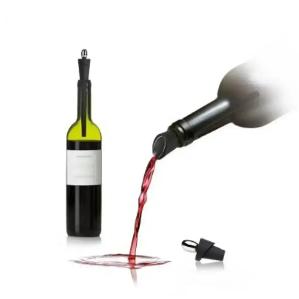 Wine bottle with a bulb-shaped device pouring red wine onto a white background