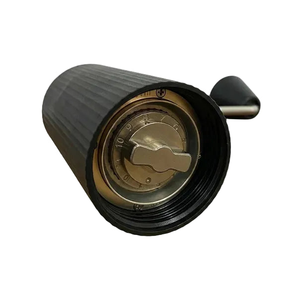 Coffee grinder showing it's stainless steel mechanism on a white background