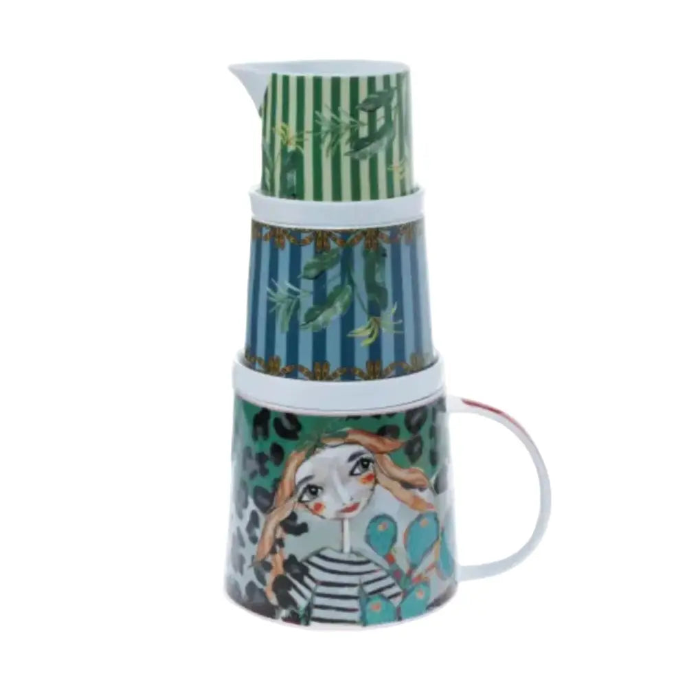 Stackable ceramic containers with green, blue, and face design on a white background