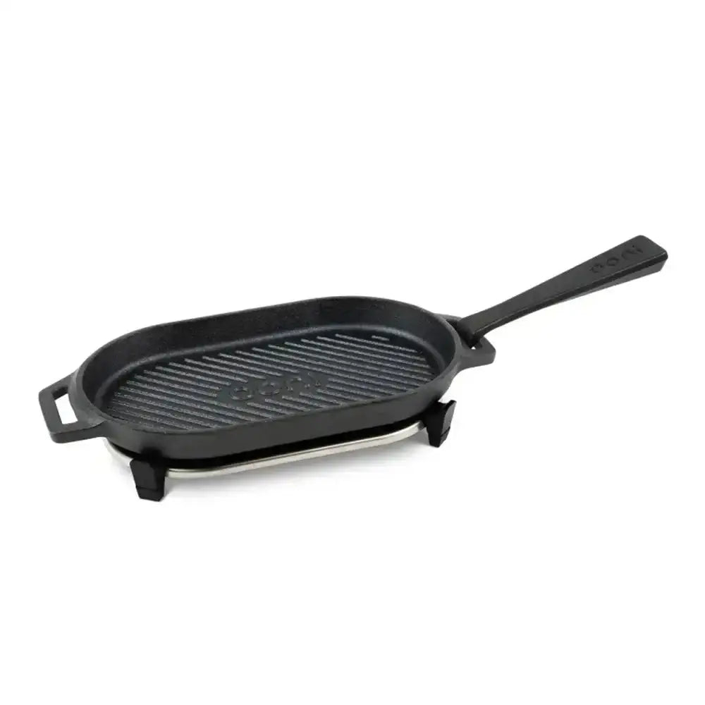 Black cast iron grill pan on a white background