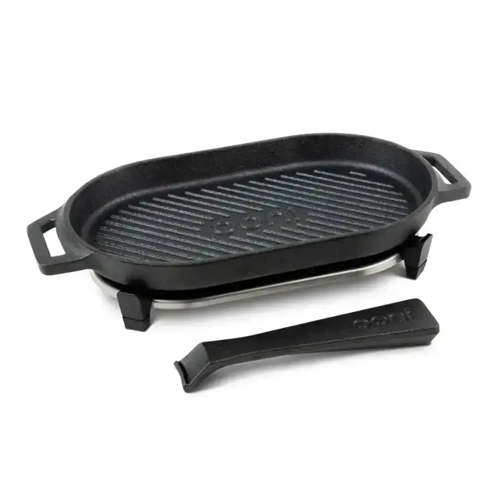 Black cast iron grill pan with handle on a white background