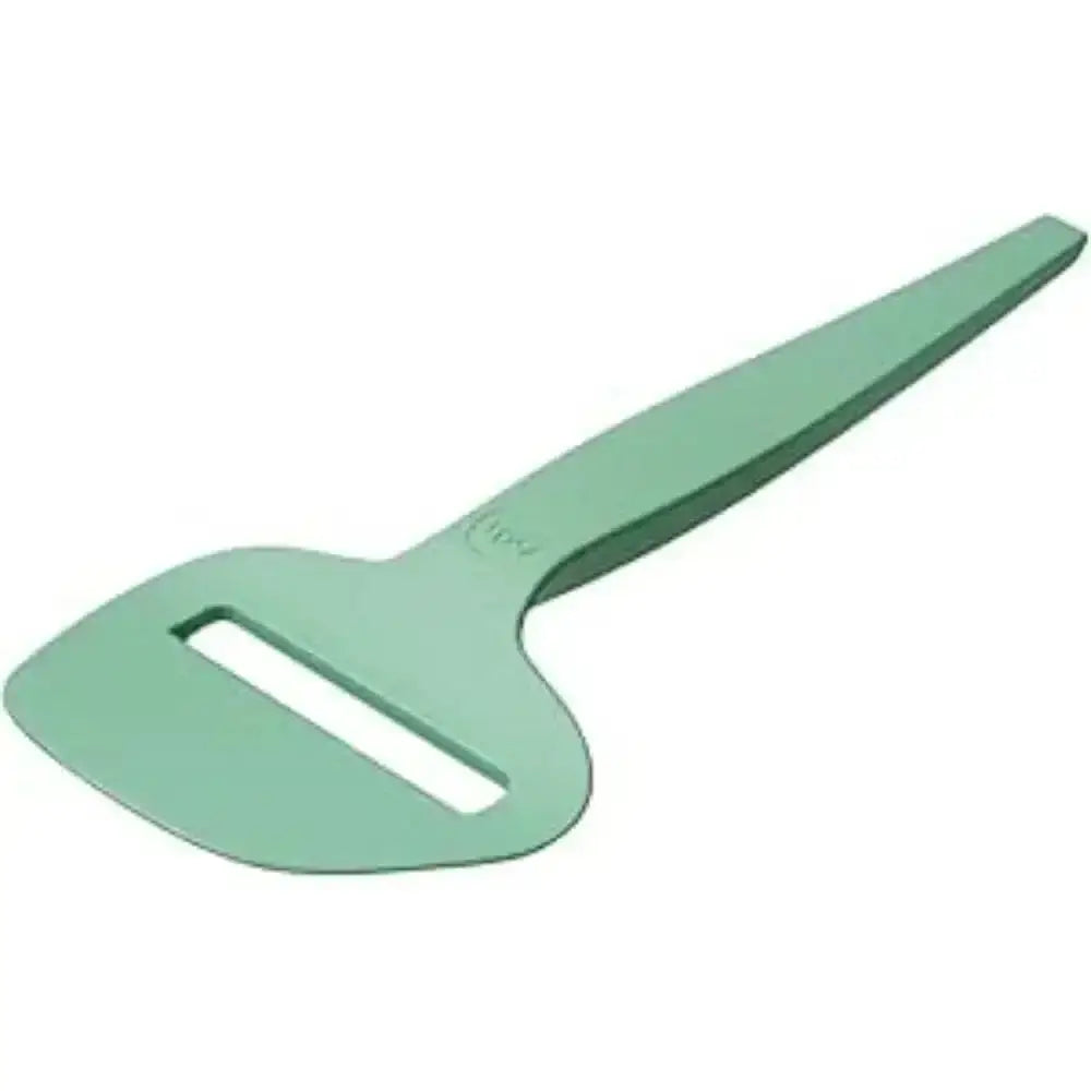 Green plastic tool on a white background
