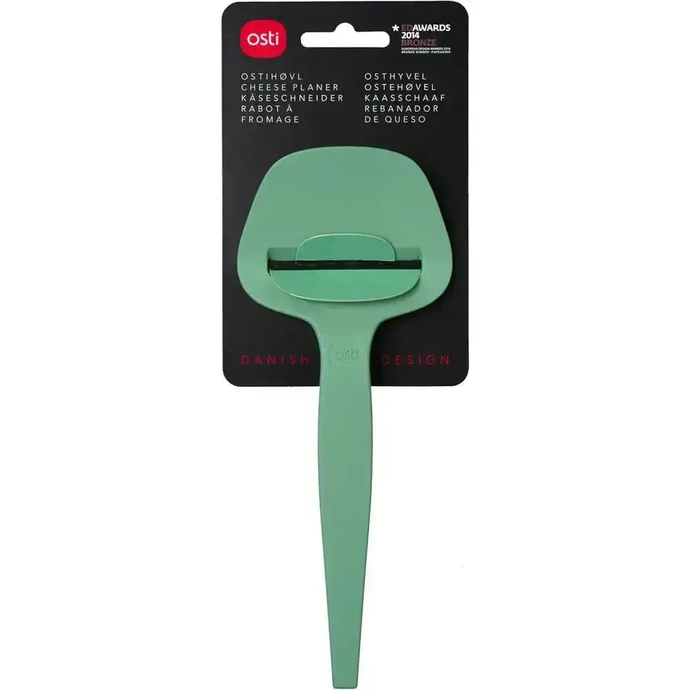 Green cheese planer with packaging on a white background