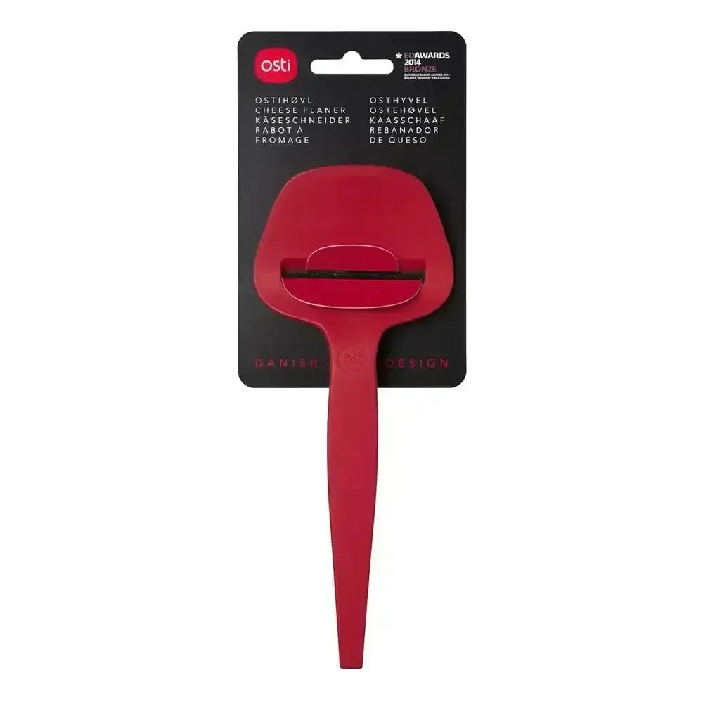 Red cheese planer with packaging on a white background