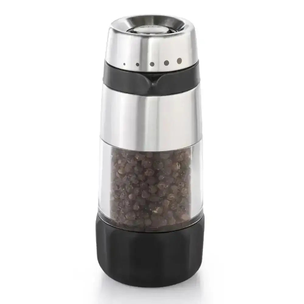 Pepper grinder with black pepper inside on a white background