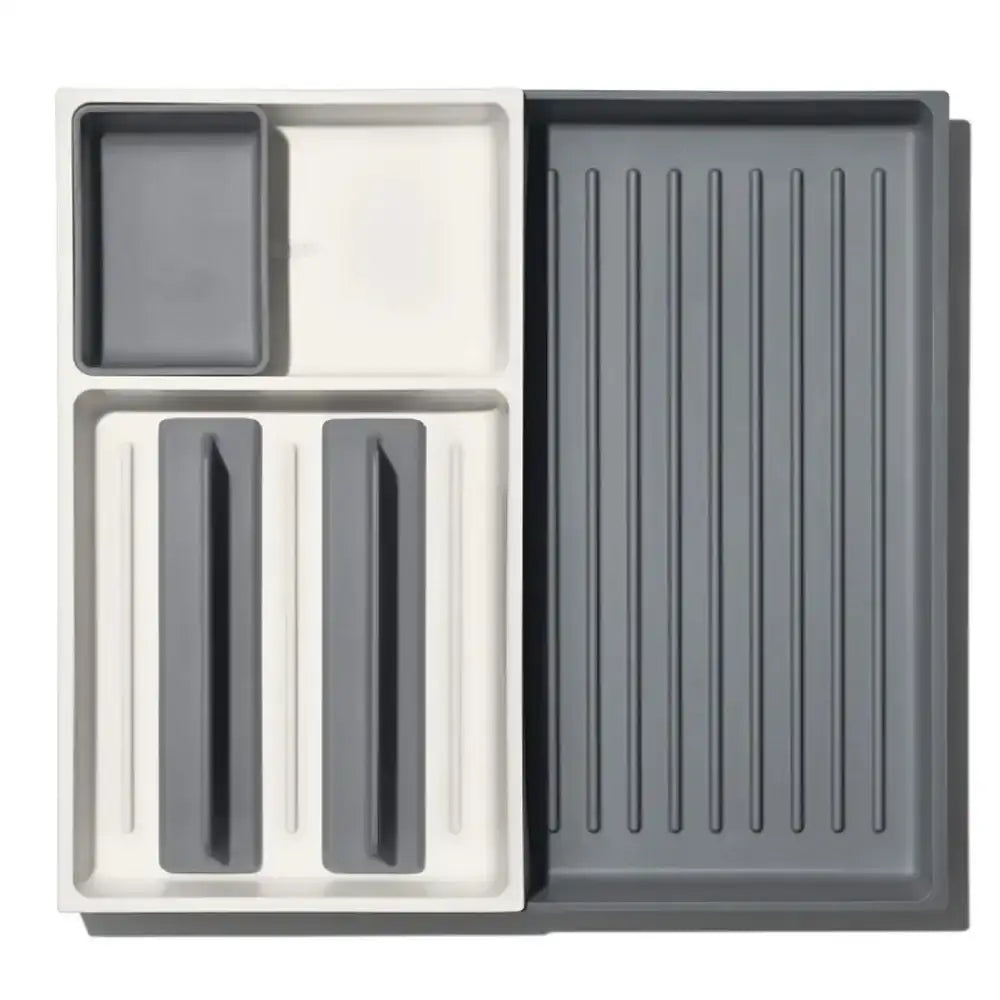 Set of gray kitchen drawers with different compartments on a white background