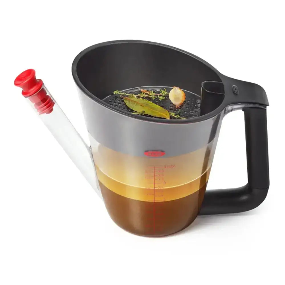 Measuring jug with clear handle and black base on a white background
