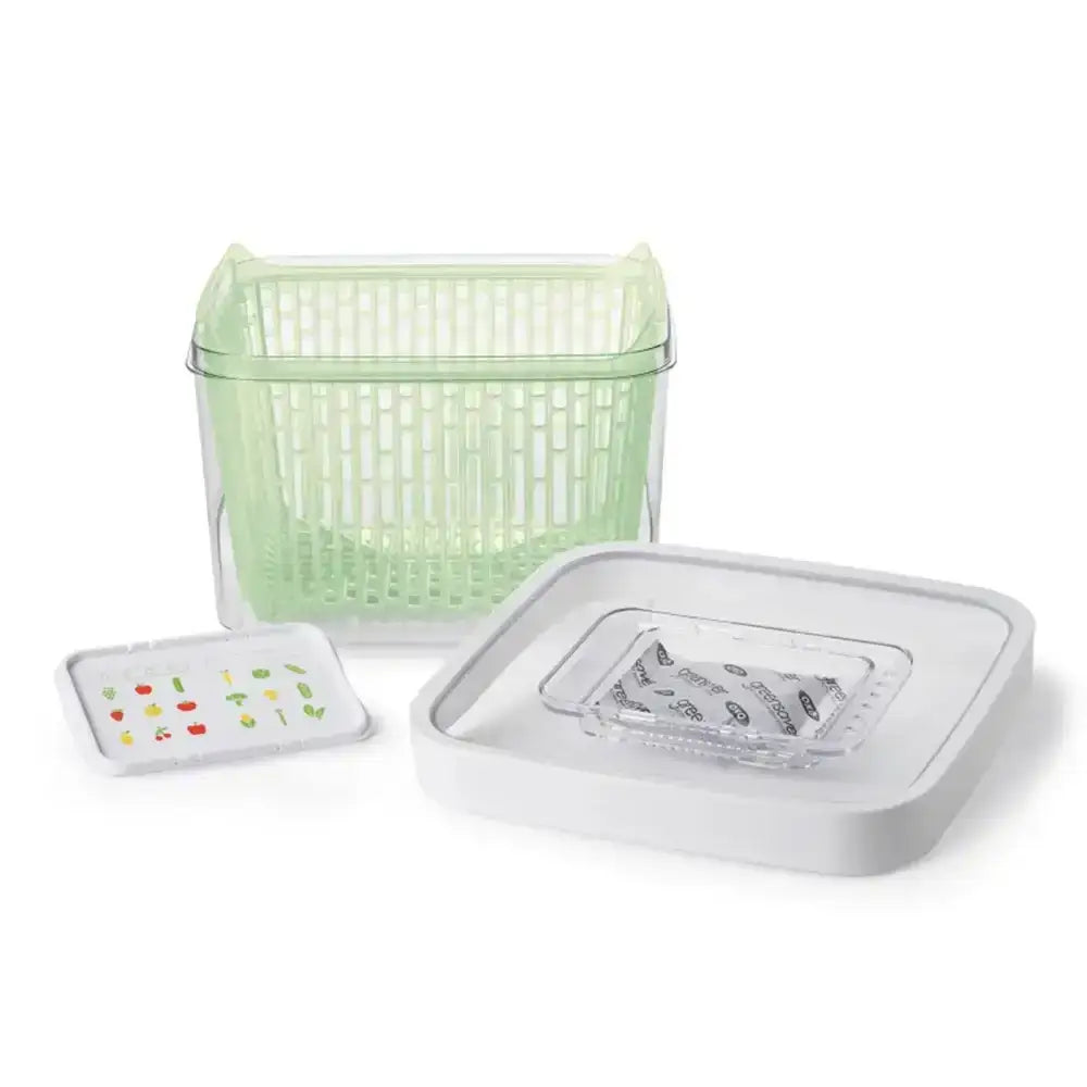 Set of three containers including a green basket and two white lids with designs on a white background