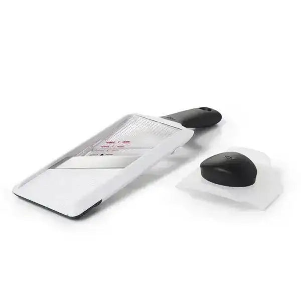 Grater with a black handle on a white background