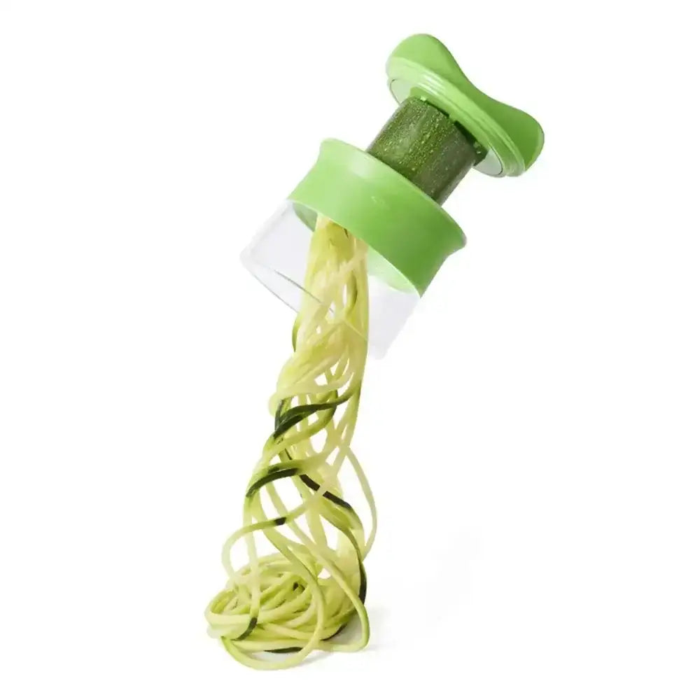 Green spiralizer with zucchini noodles on a white background