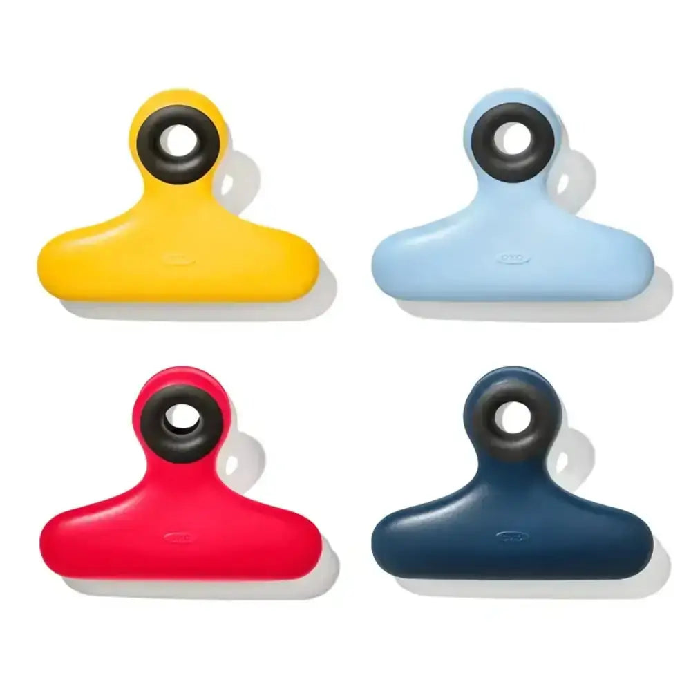 Four colorful clips in yellow, blue, red, and navy on a white background.