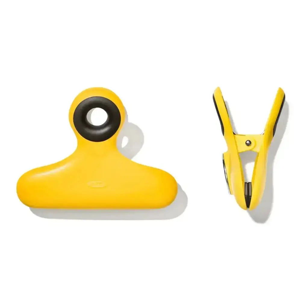 Two yellow tools with black accents on a white background