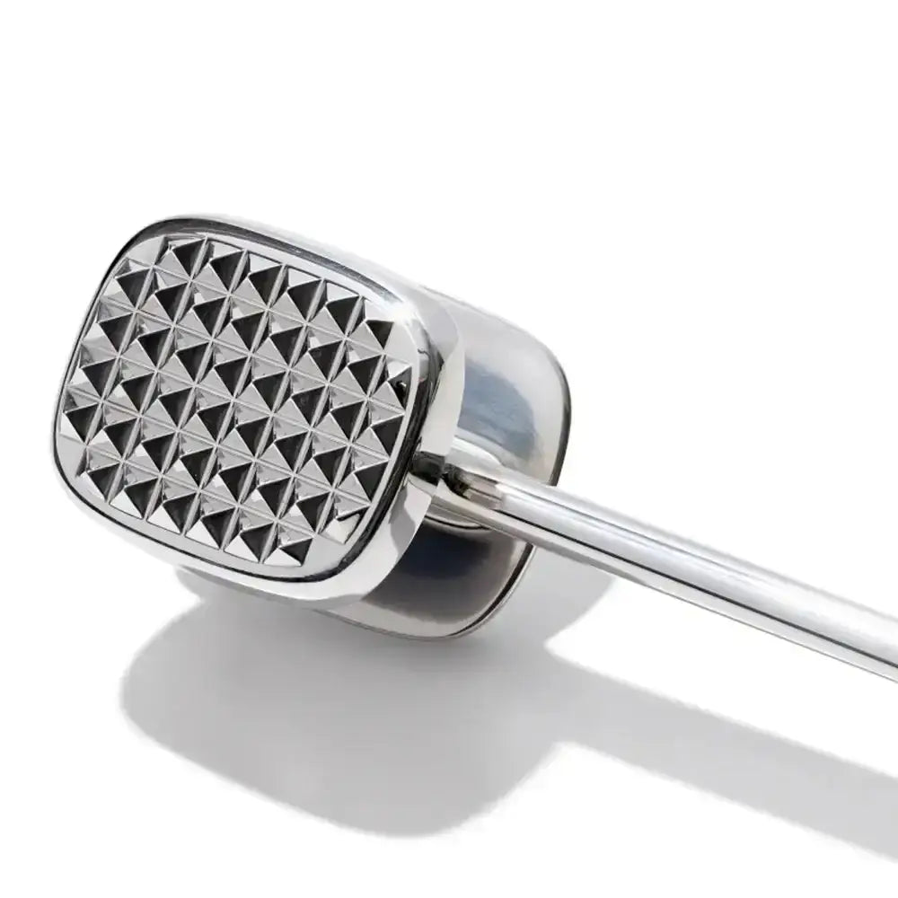 Metallic kitchen mace with textured surface on a white background