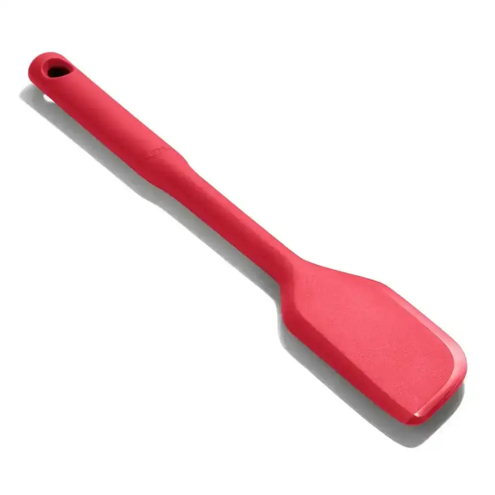 Red spatula on a white background