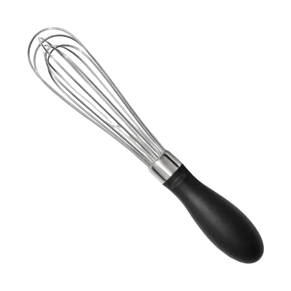 Metal whisk with black handle on a white background