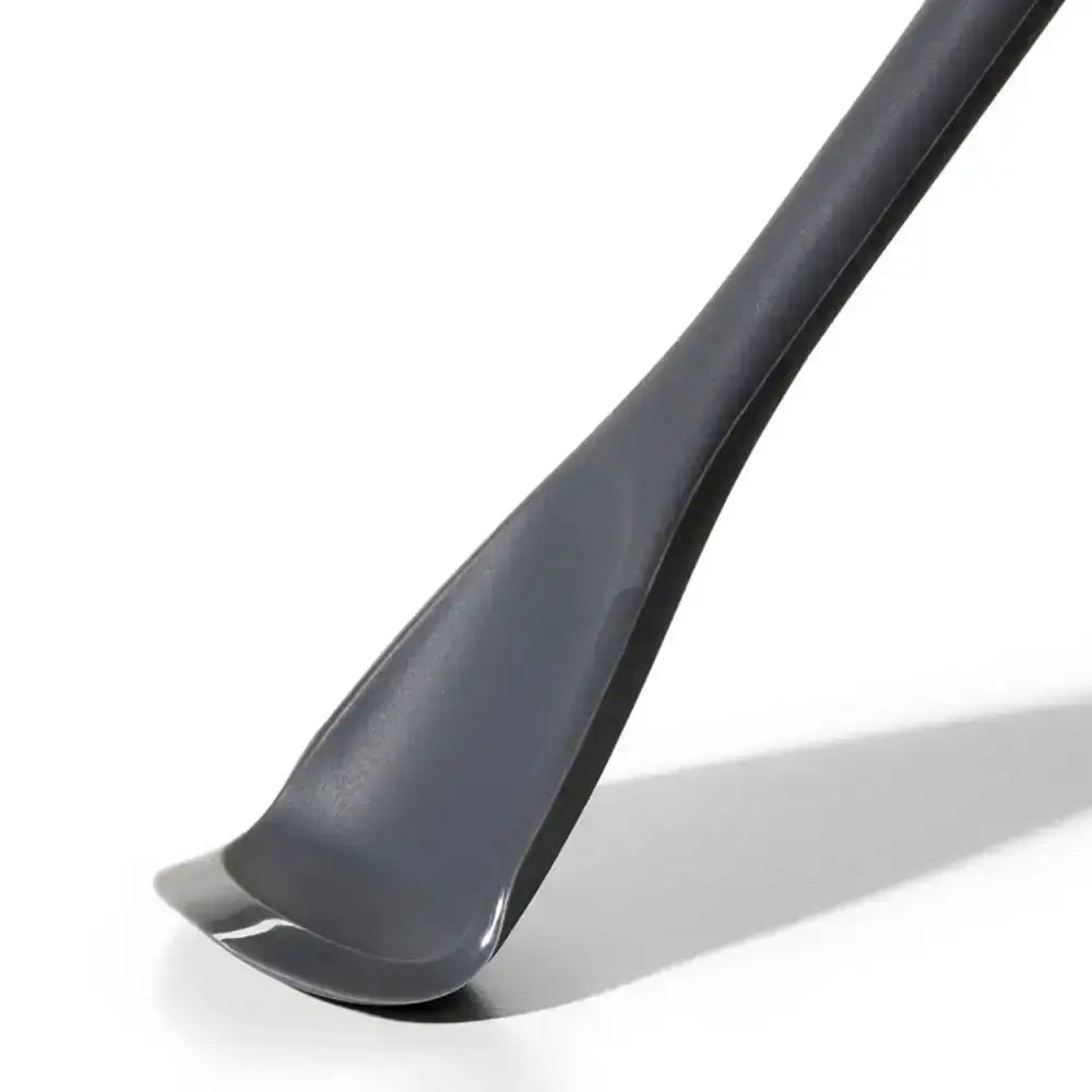 Gray flexible cooking utensil on a white background