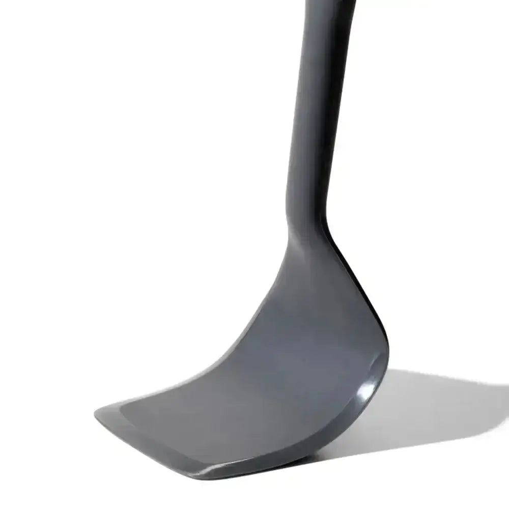 Black silicone spatula on a white background
