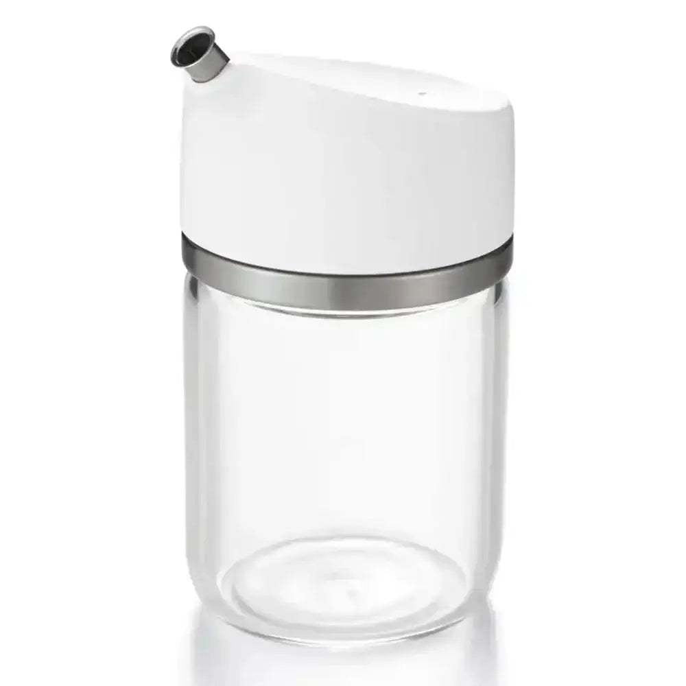 Clear glass container with a white lid and silver band on a white background