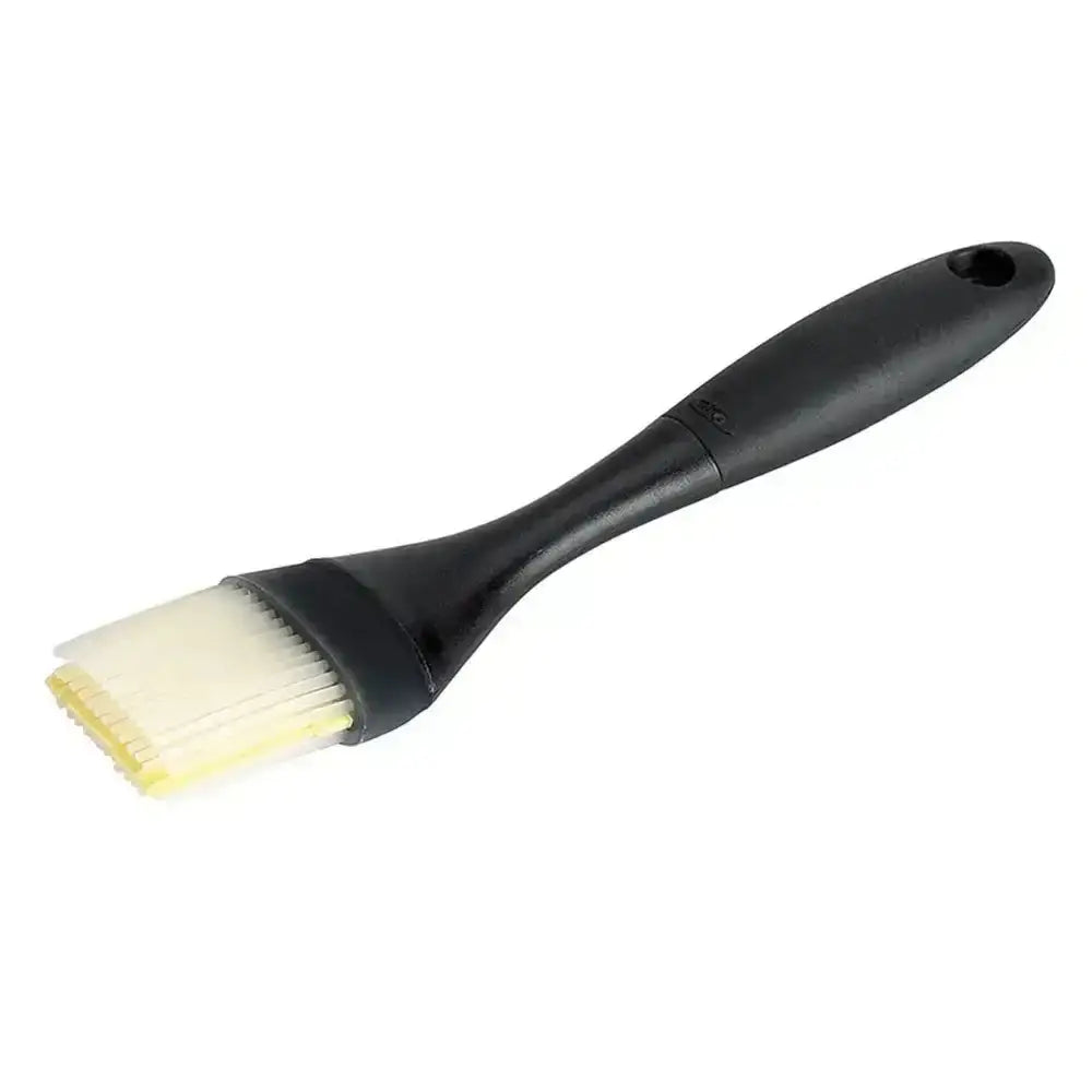 Black brush with yellow bristles on a white background