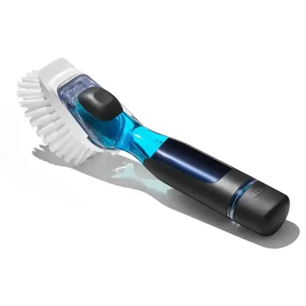 Cleaning brush with blue and black handle on a white background