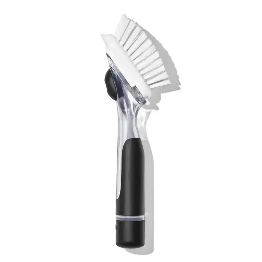 Cleaning brush with black handle on a white background