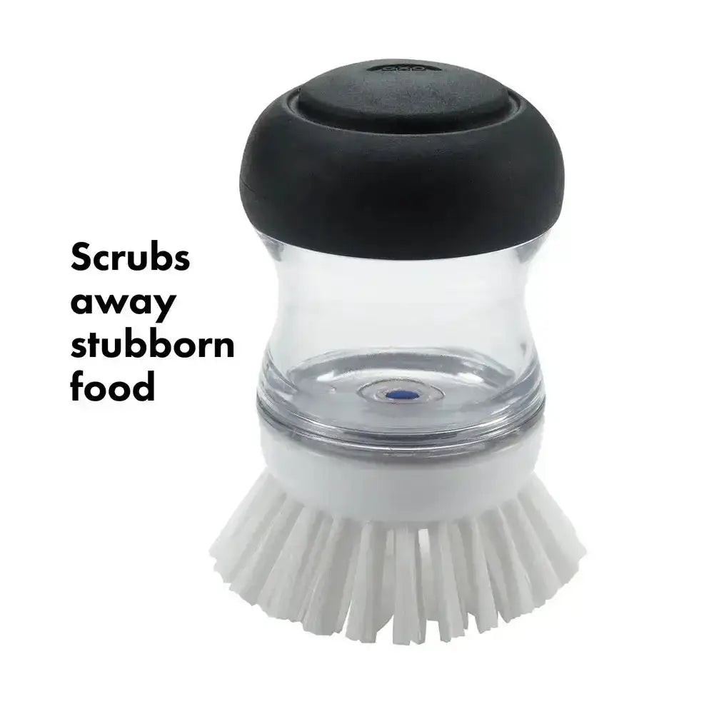 Cleaning brush with black top and white bristles on a white background