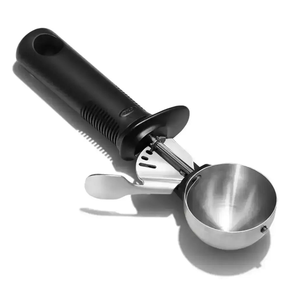 Black and silver ice cream scoop on a white background