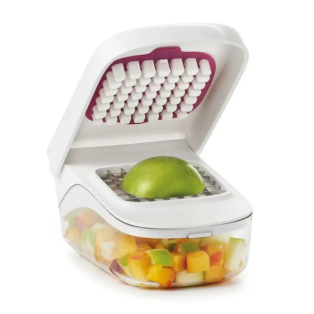 Vegetable chopper with a green apple inside on a white background