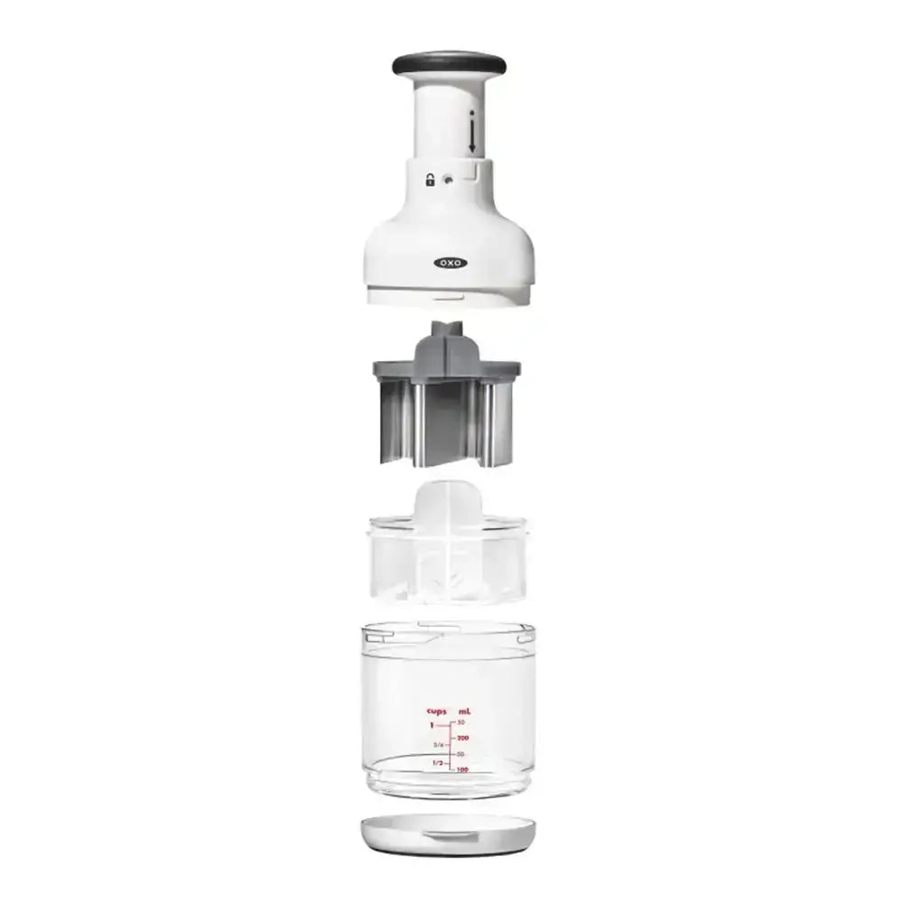 White kitchen appliance with a clear container on a white background