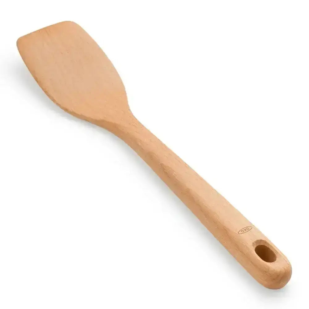 Wooden spatula on a white background