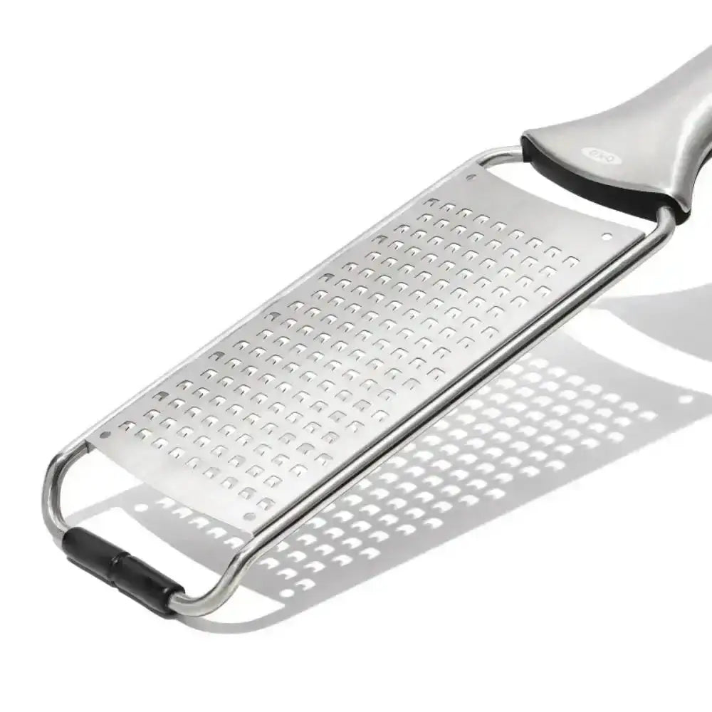 Oxo multipurpose stainless steel etched grater in silver with black rubberized grips and a sleek modern design