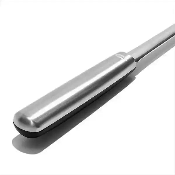 Oxo stainless steel cooking turner with silver cylindrical handle and black rubberized grip base for kitchen use