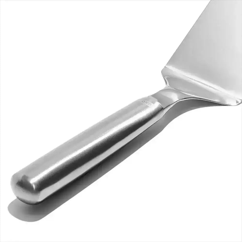 Oxo stainless steel lasagna turner with a sleek polished finish and ergonomic handle for easy serving