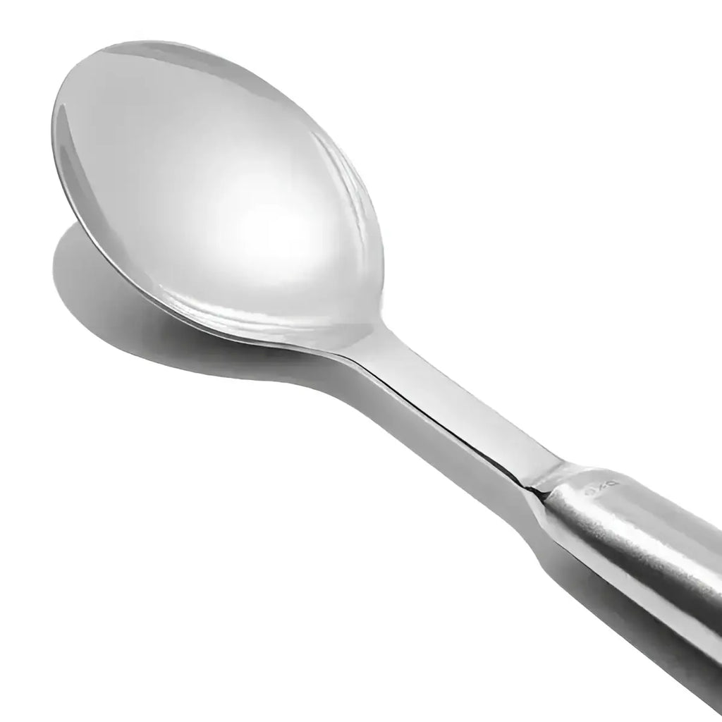 Oxo stainless steel serving spoon with shiny reflective bowl and sleek handle for durable kitchen use