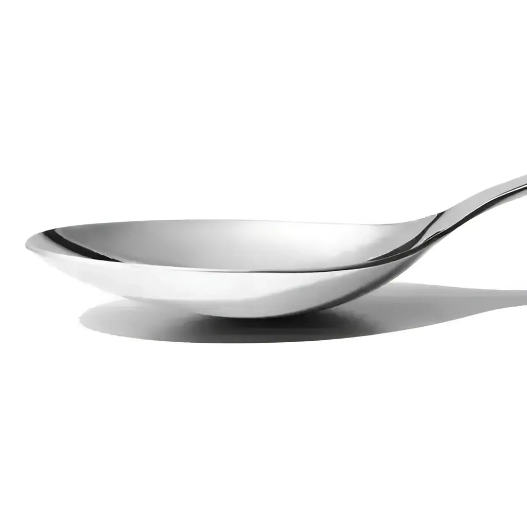 Oxo stainless steel serving spoon with a sleek polished surface and a gently curved handle for easy serving