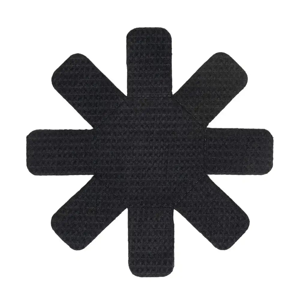 Black star-shaped patch on a white background