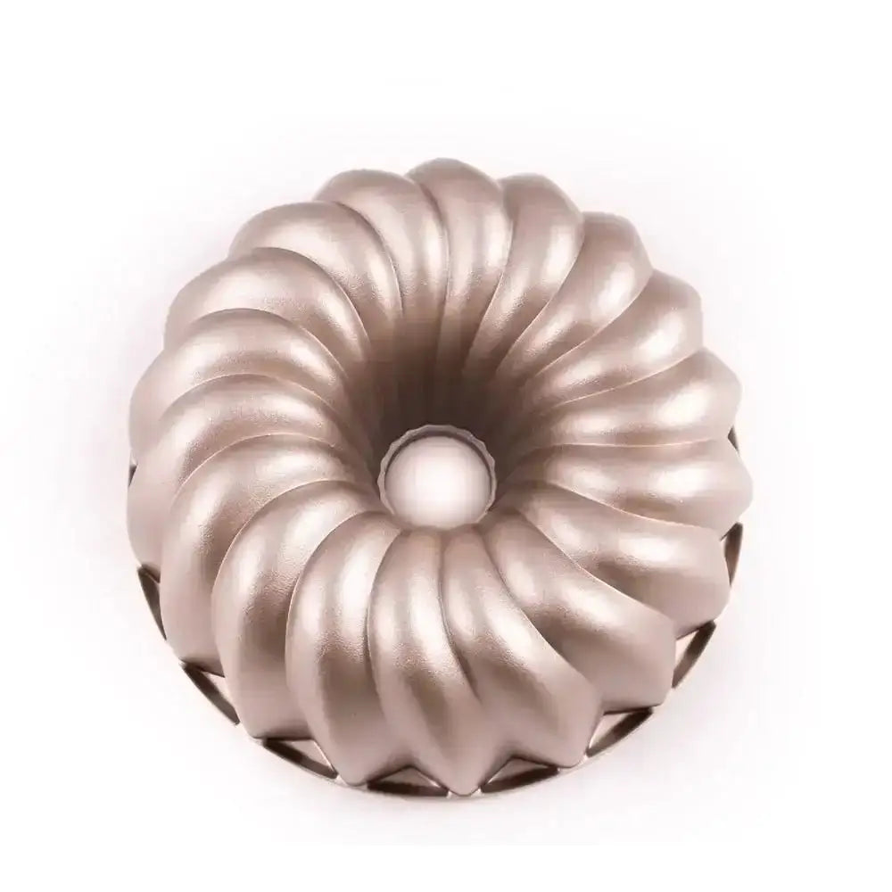 Metallic pink decorative object with a ribbed design on a white background