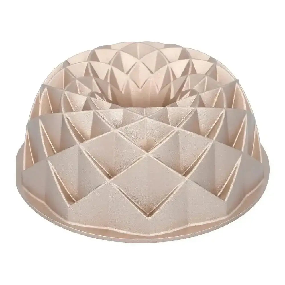 Beige geometric-patterned cake mold on a white background