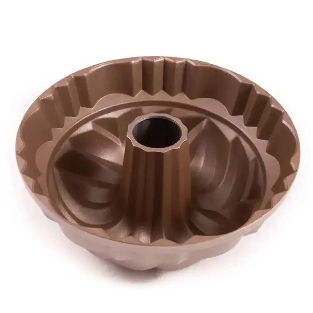 Brown Bundt cake pan on a white background