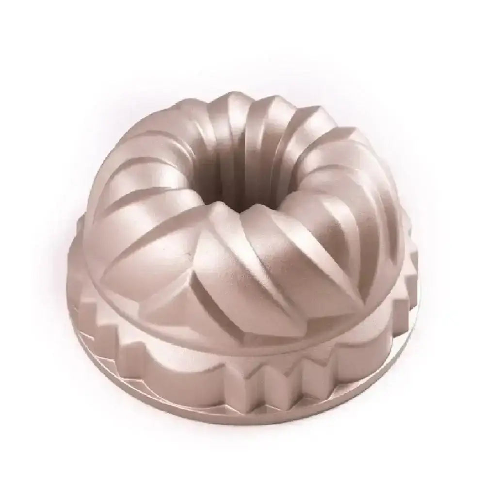 Metallic bundt cake mold on a white background