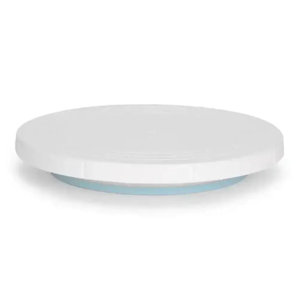 White ceramic plate with a light blue rim on a white background