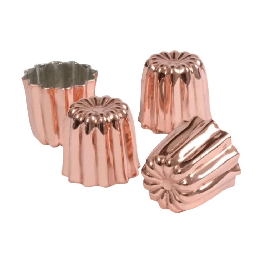 Set of four copper cake molds on a white background