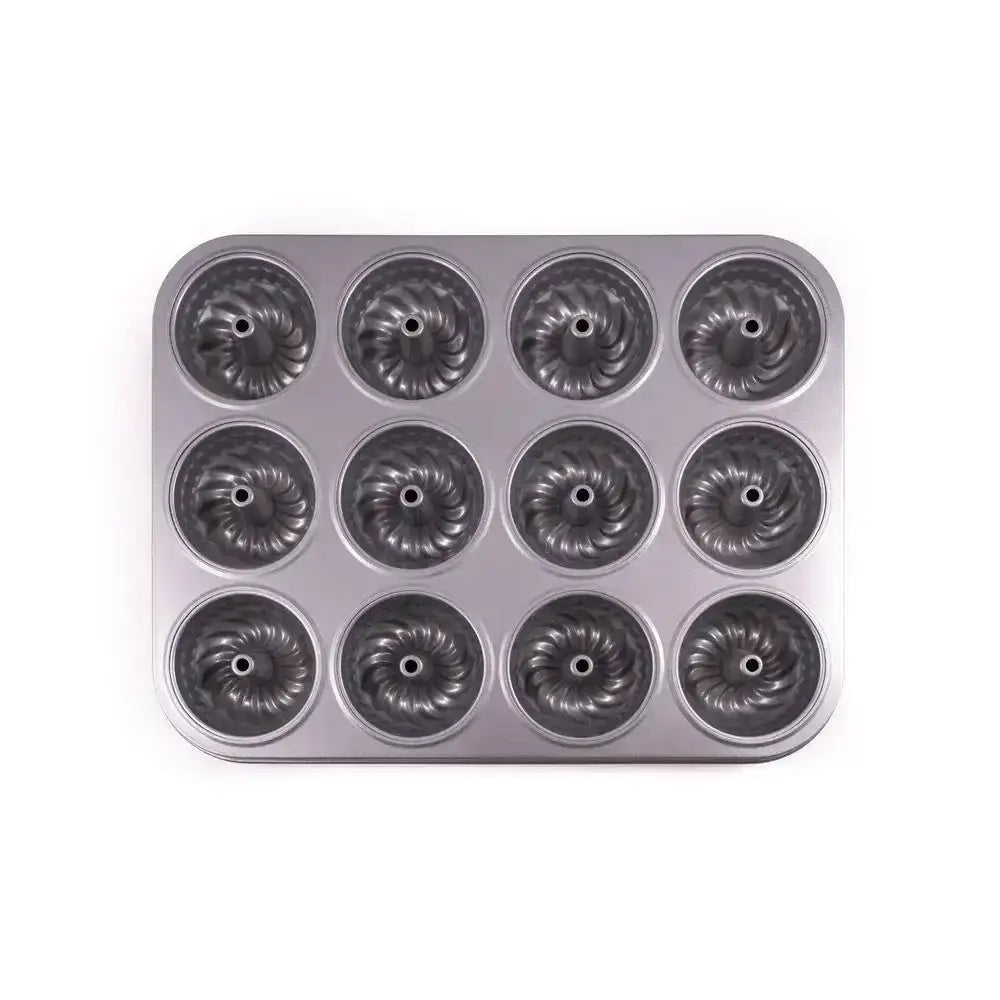 Metal muffin tin with 12 individual mold compartments on a white background
