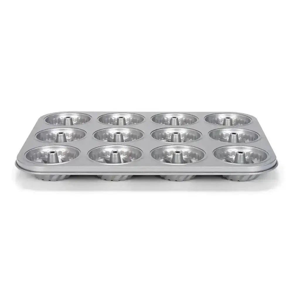 Metal muffin tin on a white background