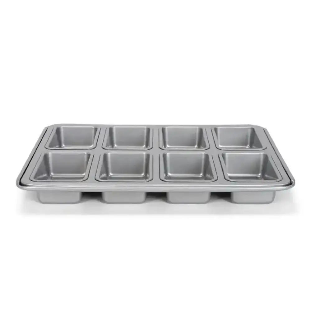 Metal muffin tin on a white background