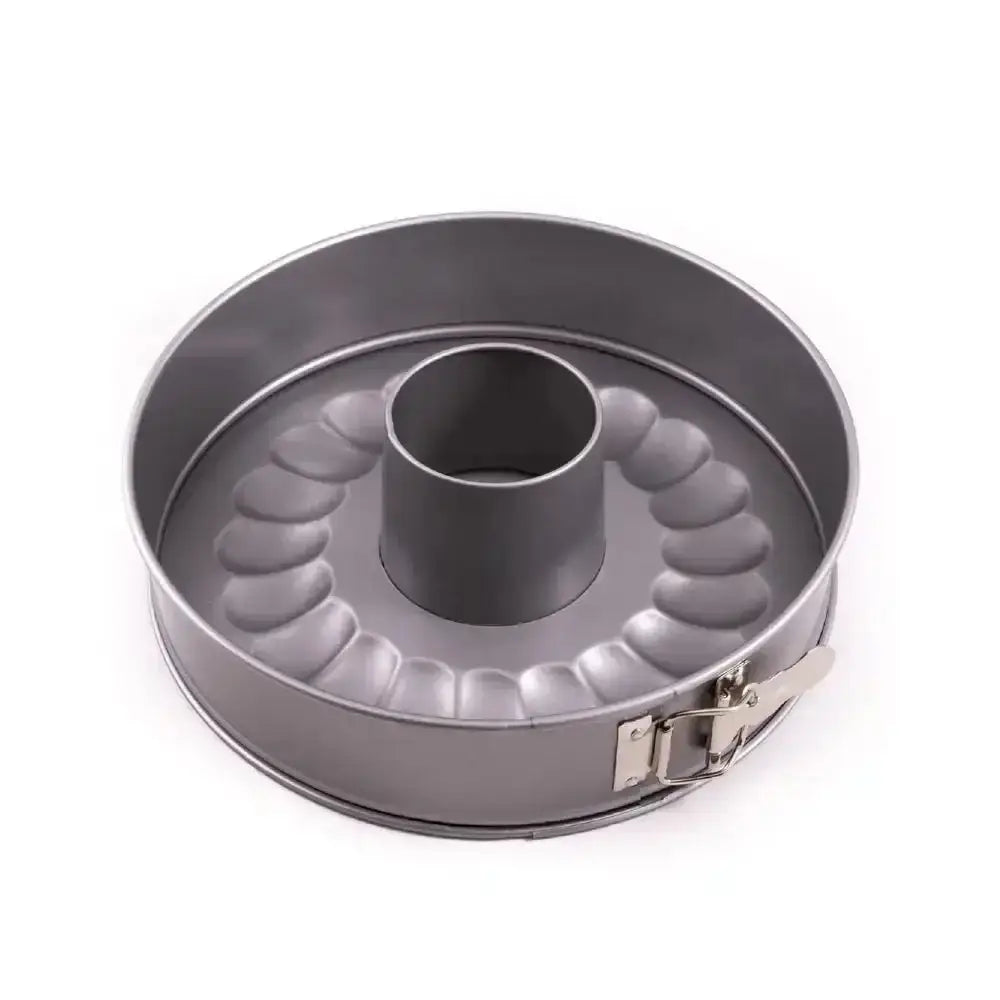Metal cake pan with a unique design on a white background