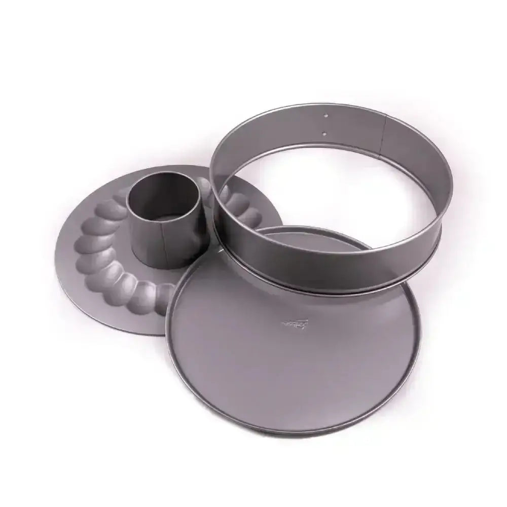 Set of three gray metal cake pans on a white background