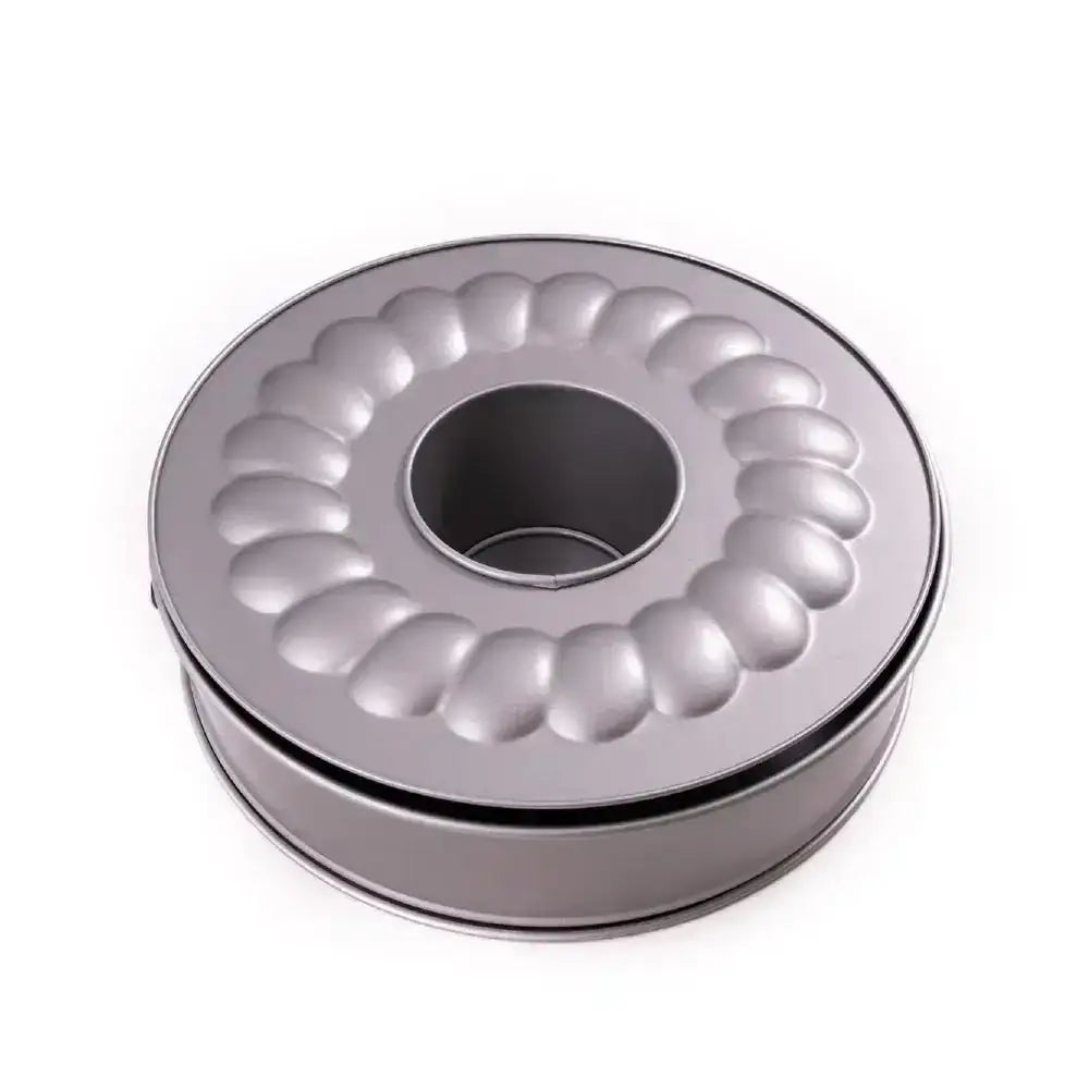 Metallic Bundt cake pan on a white background