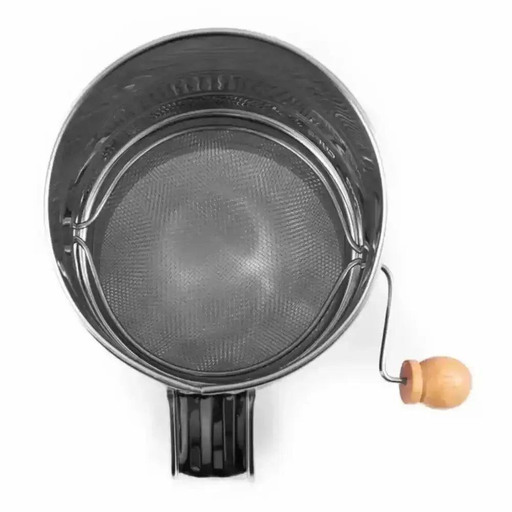 Metal flour sifter with wooden handle on a white background