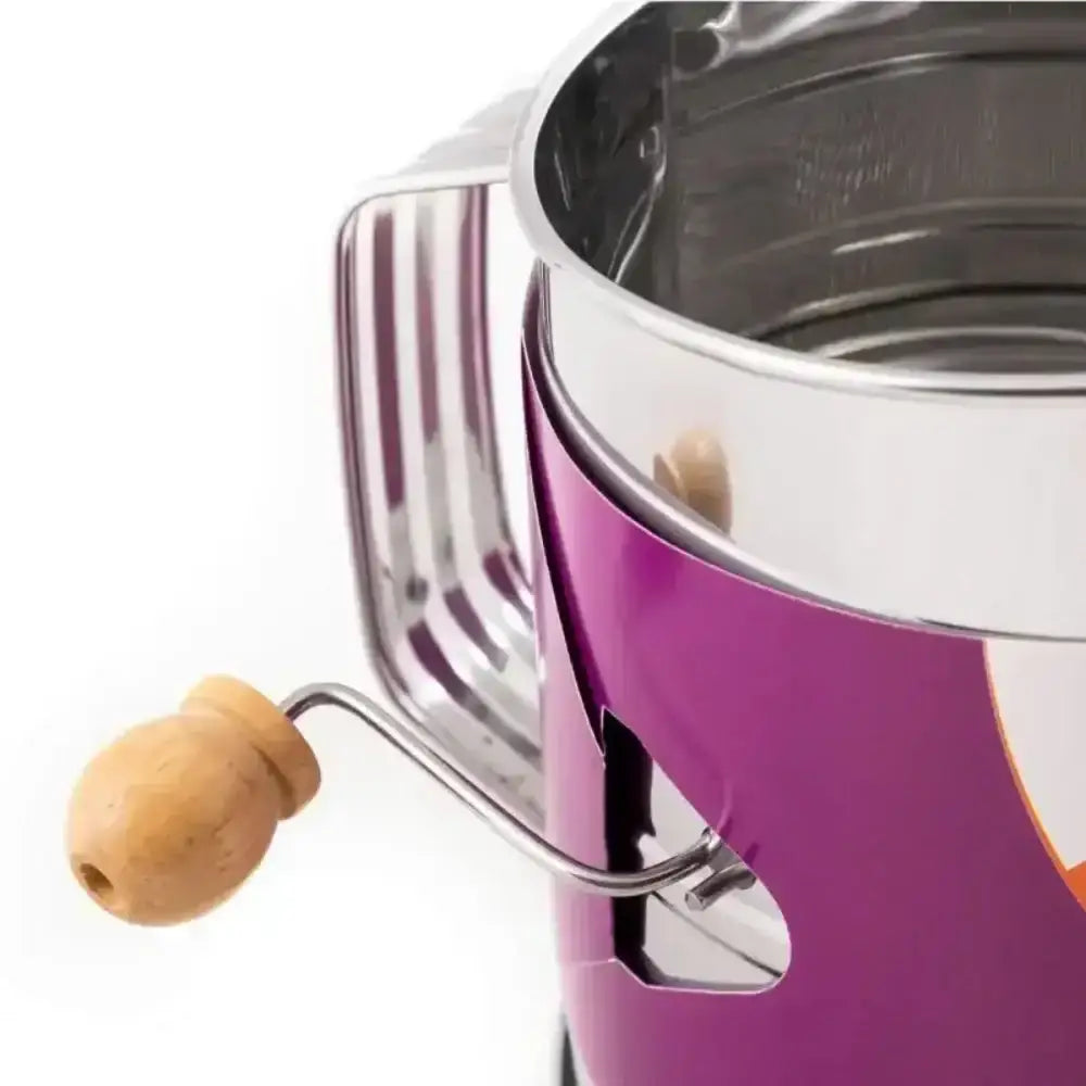 Close-up of a purple espresso machine with a wooden handle on a white background